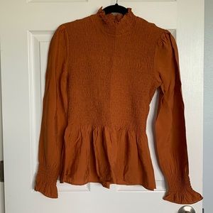 Burnt orange ruffle blouse